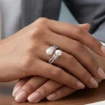 Silver plated open ring with two pearls and zirconia accents on adjustable band