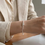 Silver plated snake chain bracelet with polished heart charm and adjustable clasp