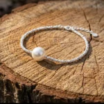 Silver plated beaded bracelet with single freshwater pearl and adjustable chain clasp