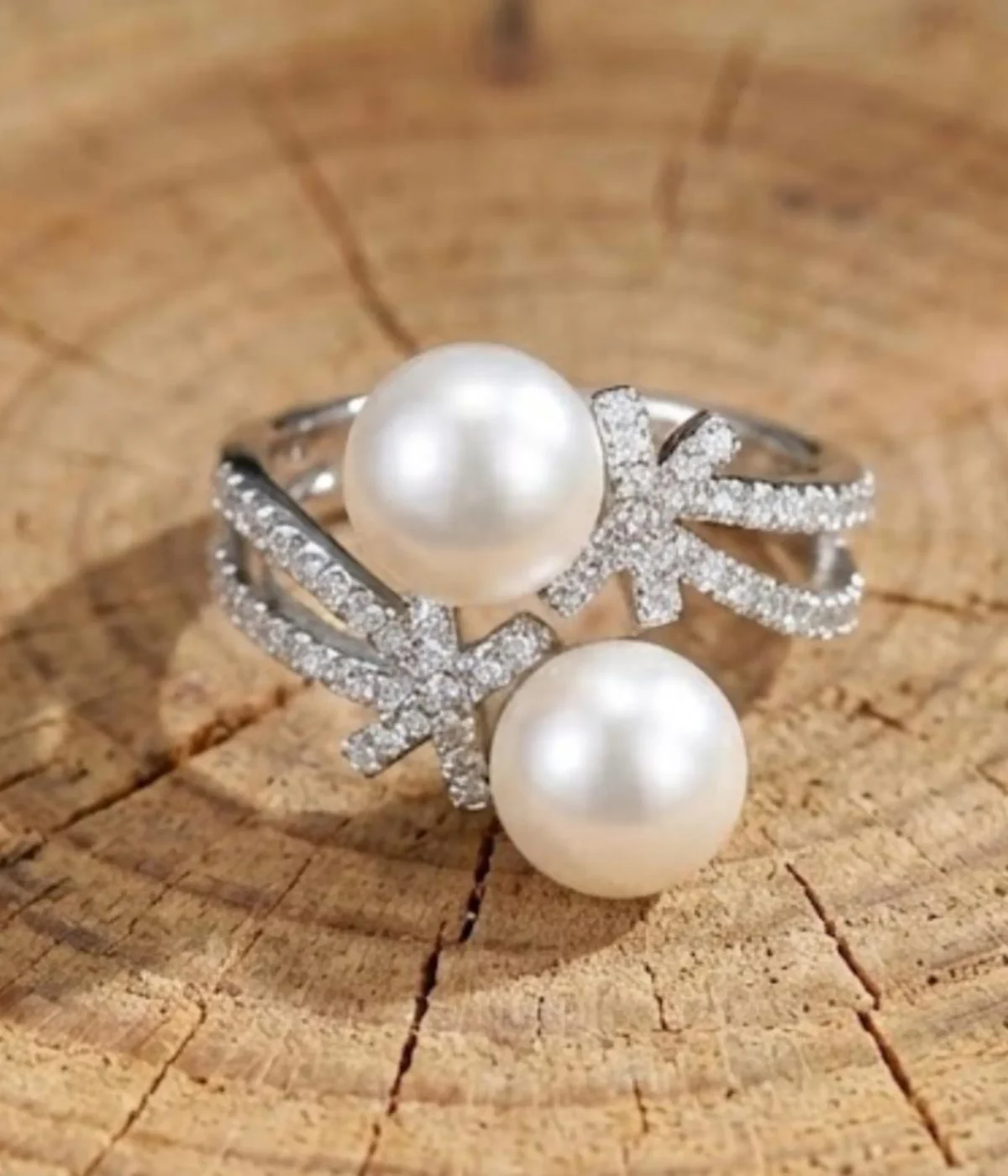 Silver plated open ring with two pearls and zirconia accents on adjustable band