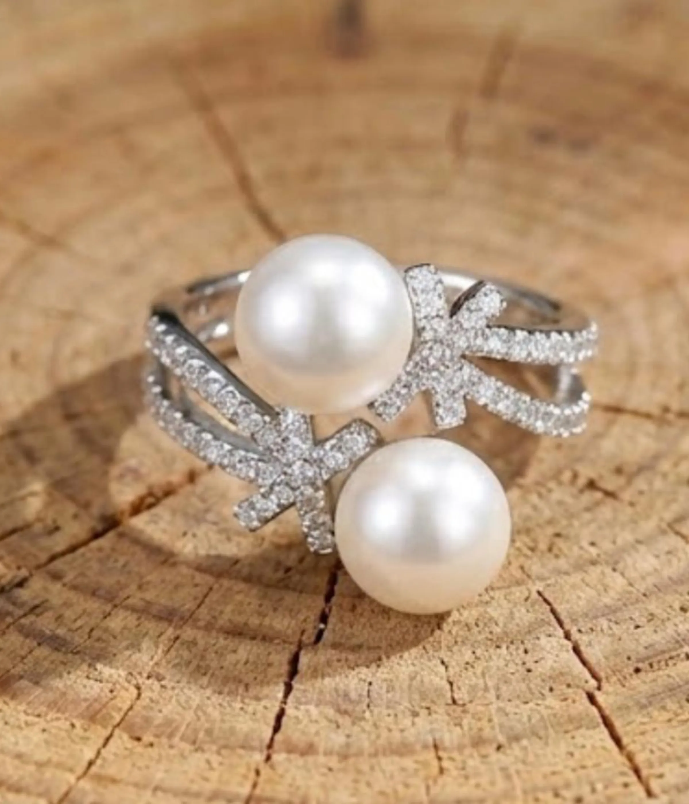 Silver plated open ring with two pearls and zirconia accents on adjustable band