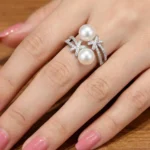 Silver plated open ring with two pearls and zirconia accents on adjustable band