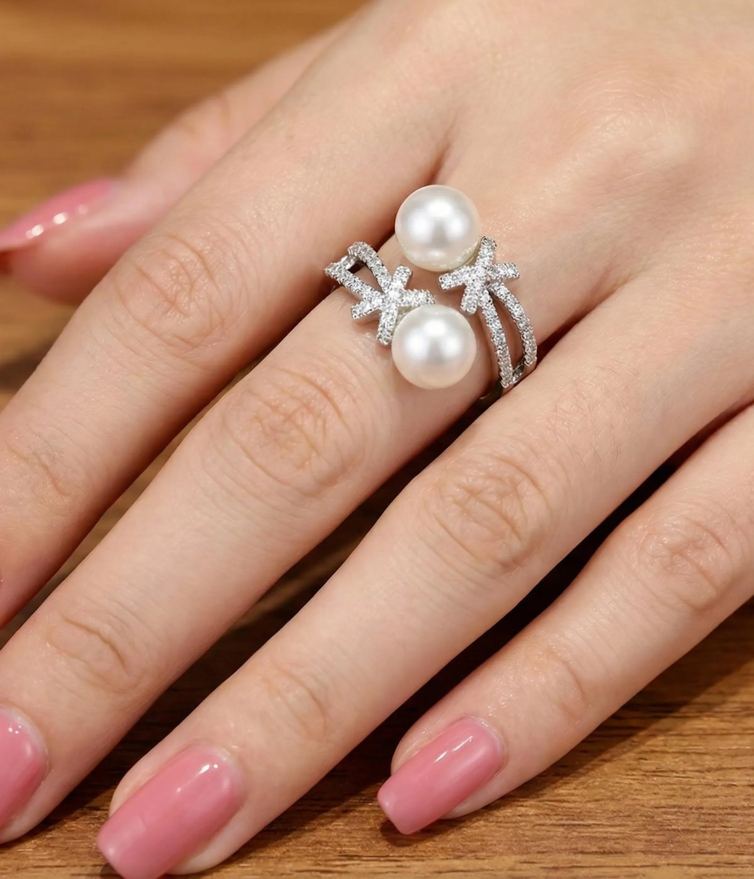 Silver plated open ring with two pearls and zirconia accents on adjustable band