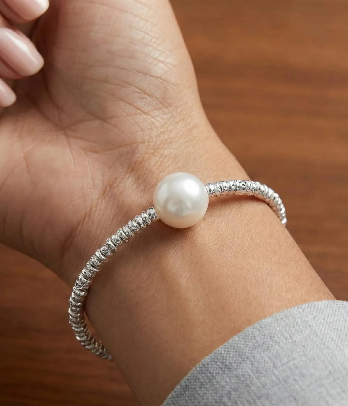 Silver plated beaded bracelet with single freshwater pearl and adjustable chain clasp