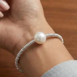 Silver plated beaded bracelet with single freshwater pearl and adjustable chain clasp