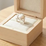 Gemini said A silver-plated statement ring featuring a large, irregular baroque pearl encased in an organic, molten-style vine setting with a high-shine polished finish.