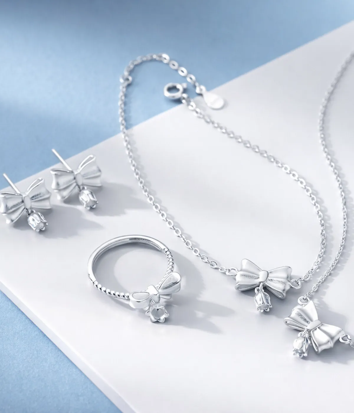 Silver Bow Charm 4 Piece Jewelry Set with Necklace, Bracelet, Ring & Earrings (A-99)